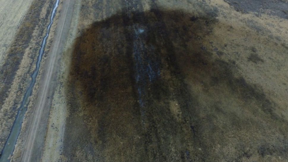This aerial photo shows spills from TransCanada Corp.'s Keystone pipeline, Friday, Nov. 17, 2017. (DroneBase via AP)