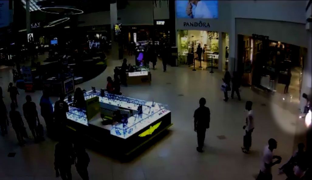 Surveillance video from Florida Mall Sunday. On the right, firecrackers go off, sparking a panic. Deputies say it gave time for the suspects to make off with a watch. (Orange County Sheriff's Office)