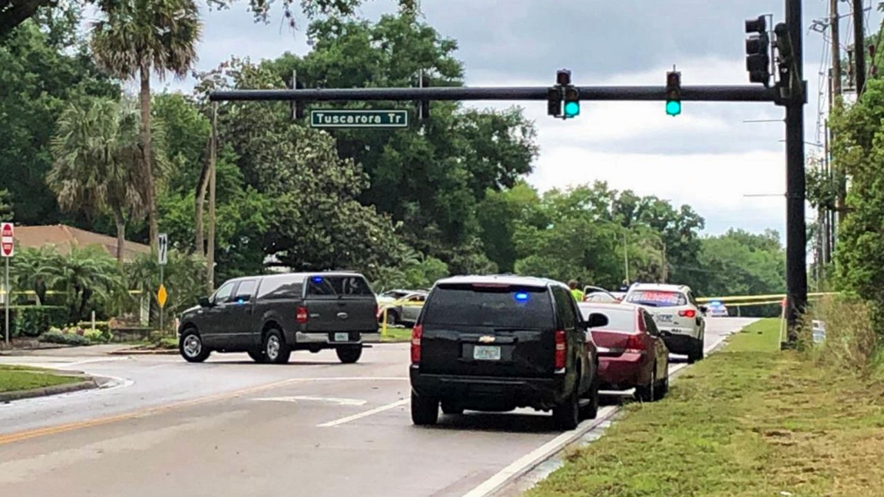 Lake Howell Road at Tuscarora Trail is shut down after an armed robbery suspect crashed into a vehicle. Authorities are still searching for the suspect. (Stephanie Coueignoux/Spectrum News 13)