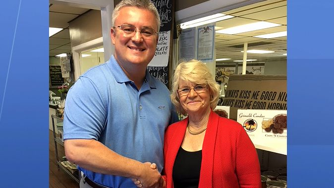 Marty L. Ward is the founder of nonprofit 'Confidence Eliminates Bullying.' She's pictured with Jim Frazier of Grimaldi Candies in Rockledge, who just joined the 'Confidence Eliminates Bullying' board of directors. (Greg Pallone, staff)