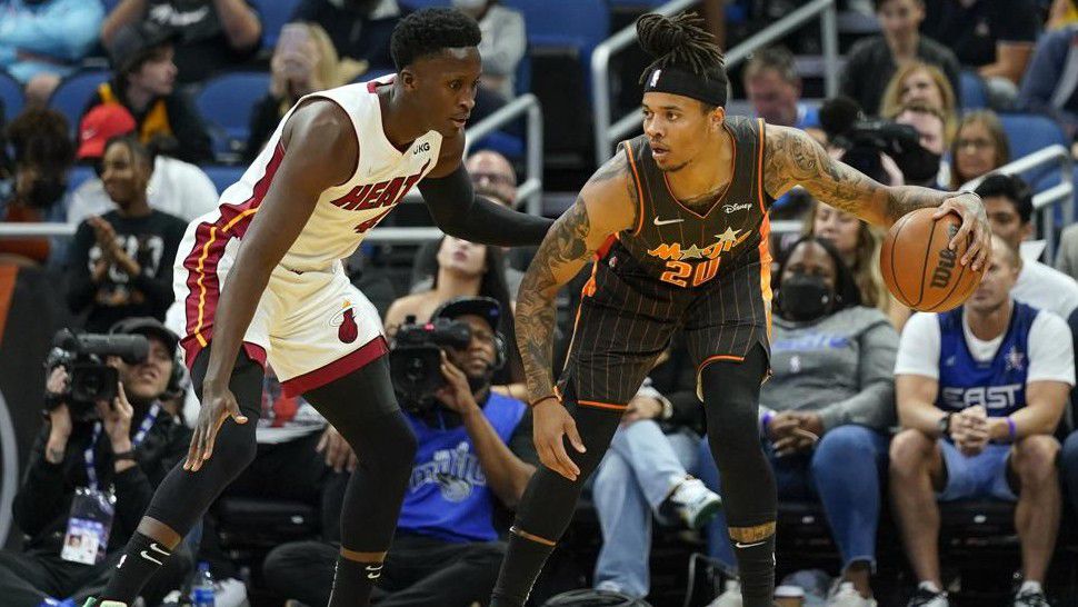 Orlando Magic's Markelle Fultz (20) loo for a path to the basket as he is defended by Miami Heat's Victor Oladipo, left, during the first half of an NBA basketball game, Sunday, April 10, 2022, in Orlando, Fla. (AP Photo/John Raoux)