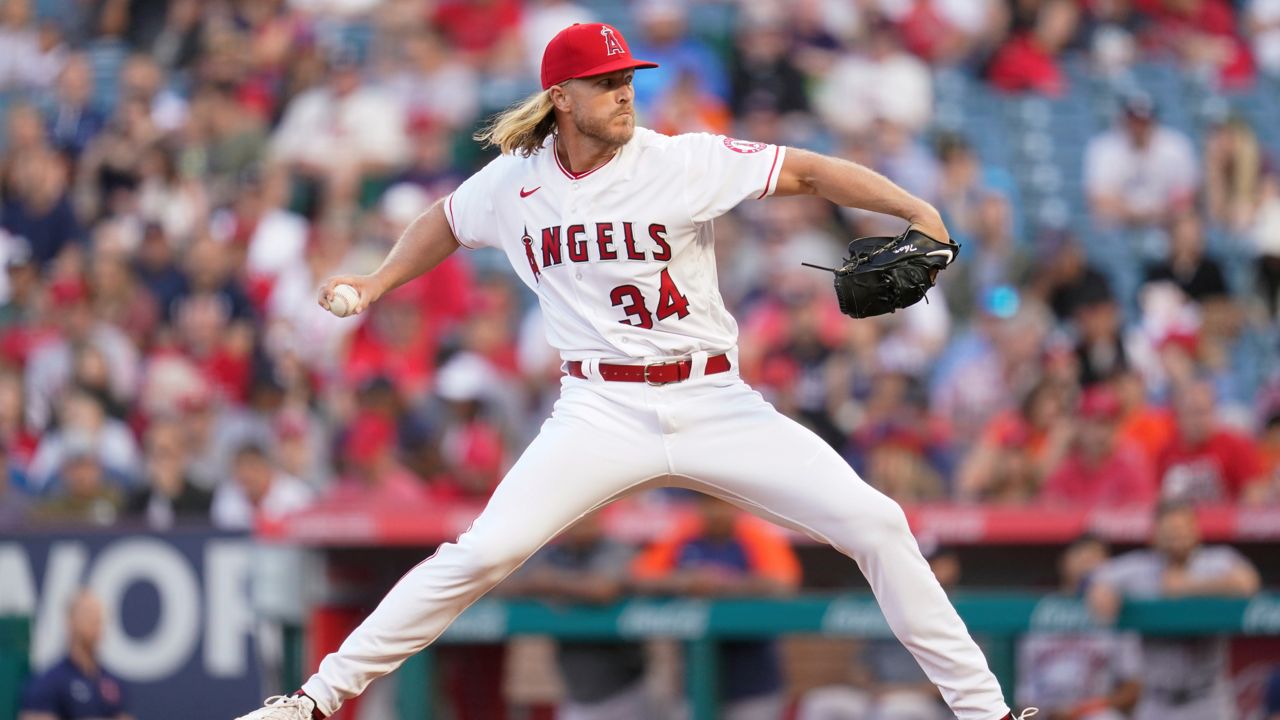 Los Angeles Angels starting pitcher Noah Syndergaard (34) throws during the first inning of a baseball game against the Houston Astros in Anaheim, Calif., Saturday, April 9, 2022. (AP Photo/Ashley Landis)