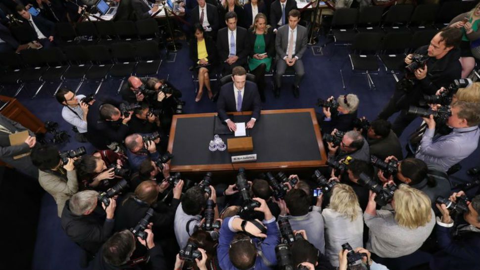 Facebook CEO Mark Zuckerberg arrives to testify before a joint hearing of the Commerce and Judiciary Committees on Capitol Hill in Washington, Tuesday, April 10, 2018, about the use of Facebook data to target American voters in the 2016 election. (AP Photo/Carolyn Kaster)