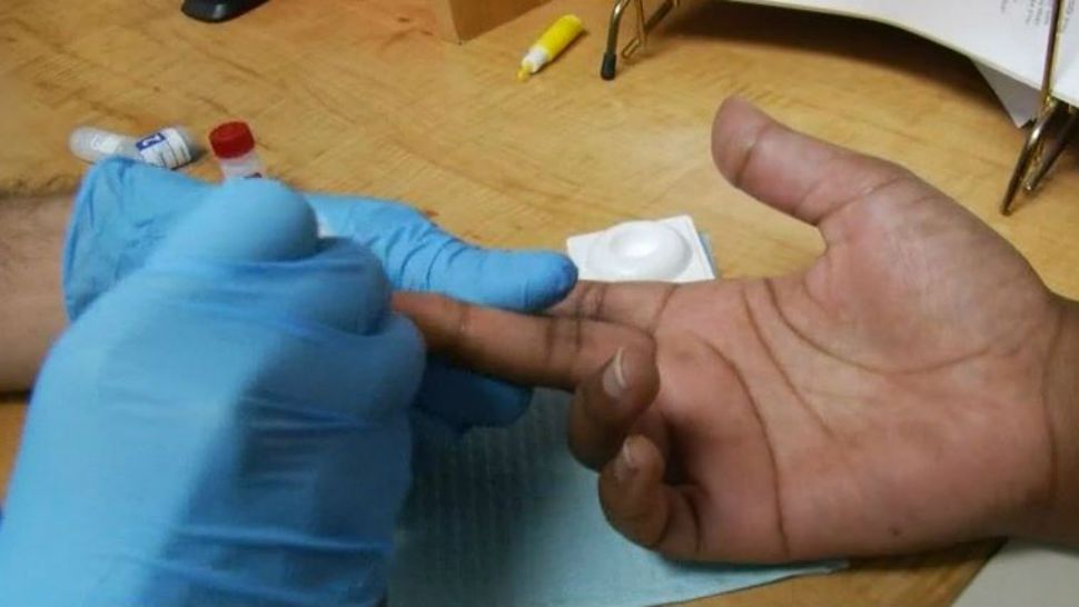 person performing HIV test