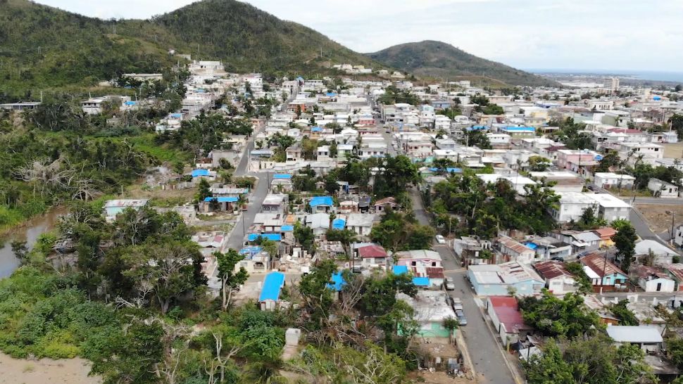 More than 6 months after Hurricane Maria tore through the island of Puerto Rico, blue tarps covered roofs over homes in the city of Guayama, near where the storm made landfall. (Tony Rojek, Spectrum News)