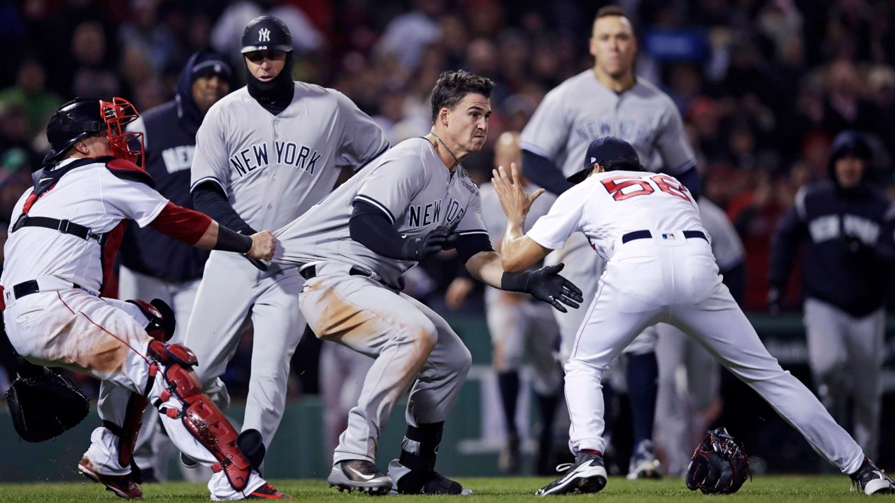 Yankees and Red Sox players fighting.