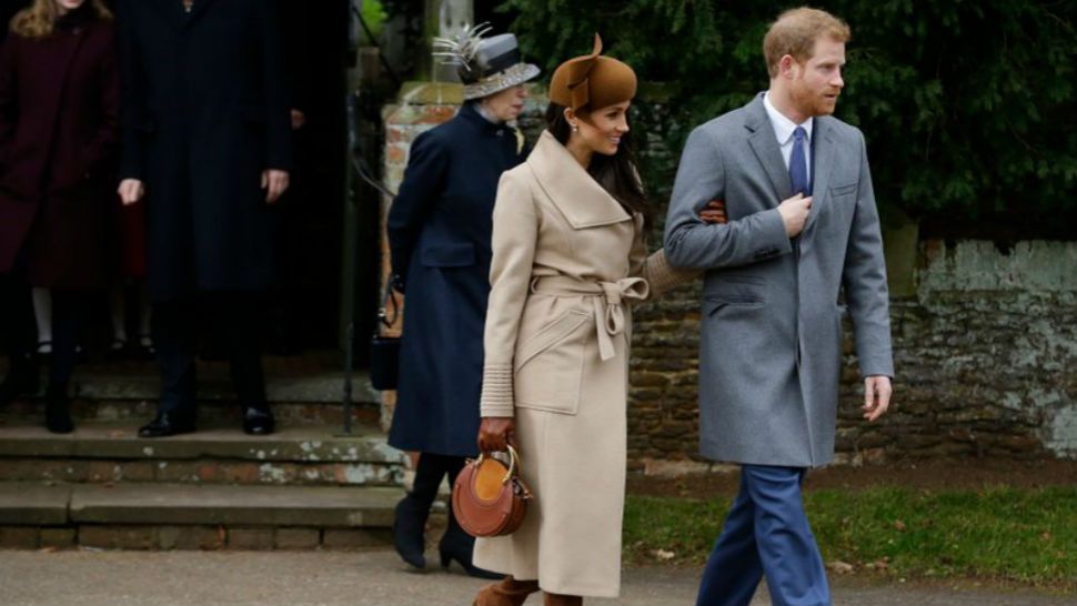 FILE - In this Monday, Dec. 25, 2017 file photo, Britain’s Prince Harry and his fiancee Meghan Markle leave the traditional Christmas Day church service, at St. Mary Magdalene Church in Sandringham, England. As Prince Harry’s future bride left a church service on the grounds of Queen Elizabeth II’s private country estate, designer Bojana Sentaler recognized her coat “I was looking for the ribbed sleeves, hoping it was a Sentaler coat,’’ said the designer, who met Markle when she was a mere TV star. The Meghan magic was almost instantaneous; Markle’s coat sold out, as Sentaler expected, and the publicity fueled sales of other designs. (AP Photo/Alastair Grant, file)