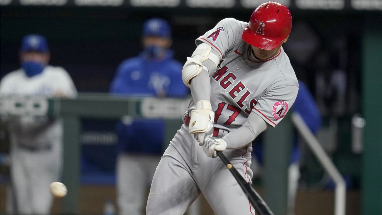 Angels DH Shohei Ohtani, who has eight RBIs in his last four games, hits a solo home run off Kansas City Royals starting pitcher Danny Duffy during the fifth inning of a baseball game at Kauffman Stadium in Kansas City, Mo., Tuesday, April 13, 2021. (AP Photo/Orlin Wagner)