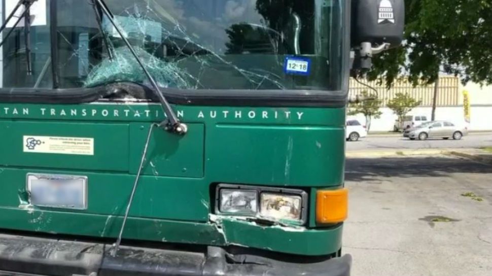 Photo of damage to a Cap Metro bus that a man in a truck collided with according to Austin EMS.