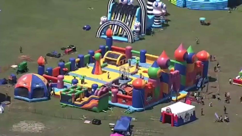 The 900-foot-long bounce house has slides, a basketball court, inflatable aliens and a ball pit. (Spectrum News)