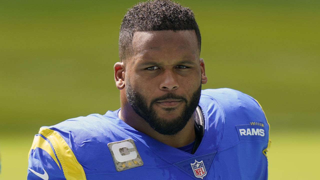 Los Angeles Rams DE Aaron Donald stands on the sidelines during the first half of an NFL football game against the Miami Dolphins in Miami Gardens, Fla., on Sunday, Nov. 1, 2020. (AP Photo/Lynne Sladky)