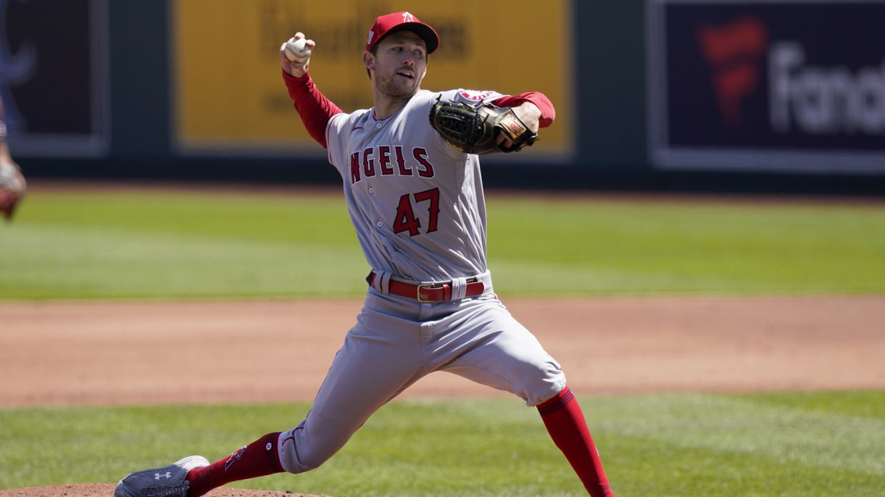Los Angeles Angels starting pitcher Griffin Canning delivers to a Kansas City Royals batter during the first inning of a baseball game at Kauffman Stadium in Kansas City, Mo., Wednesday, April 14, 2021. (AP Photo/Orlin Wagner)