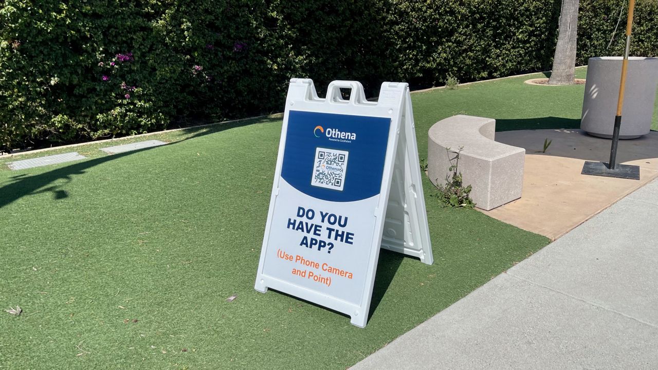 A sign for the Othena app at the Orange County fairgrounds in Costa Mesa, Calif. April 8, 2021. (Paco Ramos-Moreno/ Spectrum News 1)