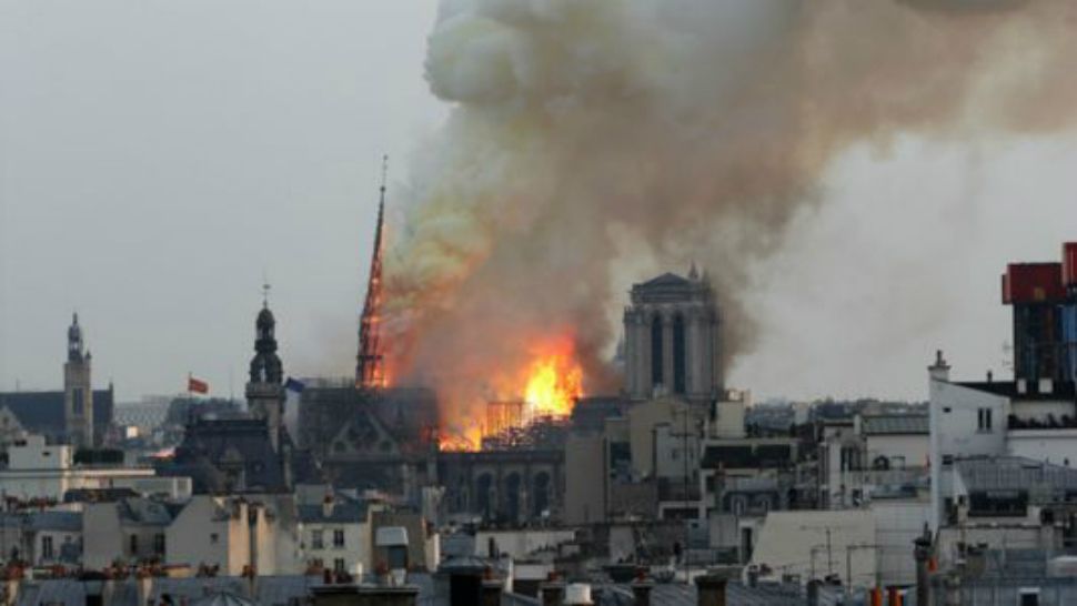 Flames rise from Notre Dame cathedral in Paris as it burns Monday, April 15, 2019. (Thibault Camus/AP)