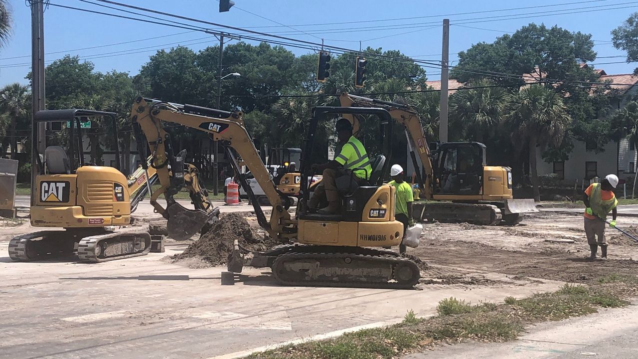 Crews work to repair a water main break at the intersection of Gandy and Himes in South Tampa. (Ashley Paul/Spectrum Bay News 9)