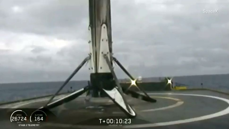 The main booster core of the Falcon Heavy rocket sits on the drone ship in the Atlantic Ocean just over 10 minutes after taking off from Kennedy Space Center in Florida. (SpaceX)