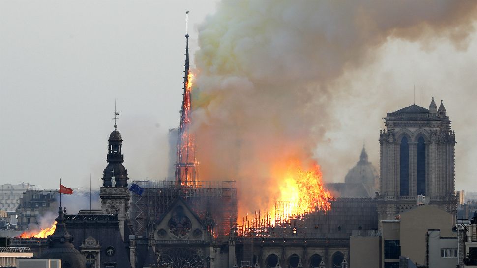 Flames engulf the spire of Notre Dame cathedral in Paris on Monday, April 15, 2019. (Thibault Camus/AP)