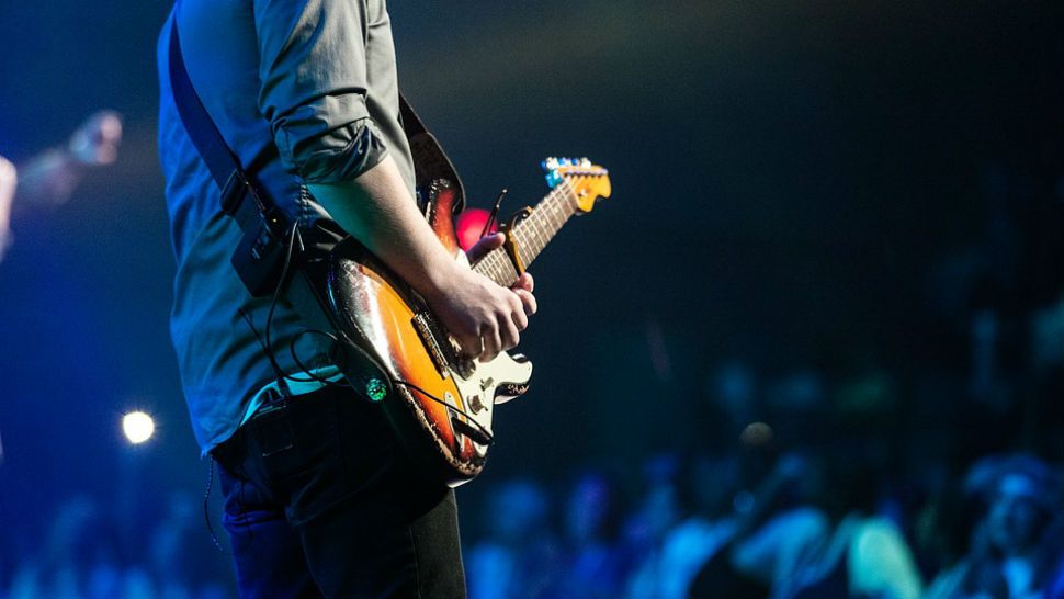 FILE photo of a musician playing the electric guitar during a show. (Pixabay)
