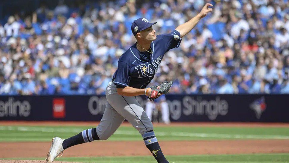 Tampa Bay Rays pitcher Jason Adam, left, and catcher Christian