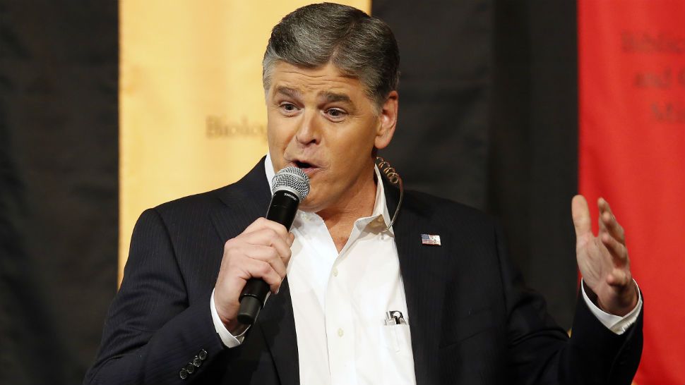 FILE- In this March 18, 2016 file photo, Fox News Channel's Sean Hannity speaks during a campaign rally for Republican presidential candidate, Sen. Ted Cruz, R-Texas, in Phoenix. Hannity and TV producer David Simon are tossing vulgarities at each other on social media. (AP Photo/Rick Scuteri, File)