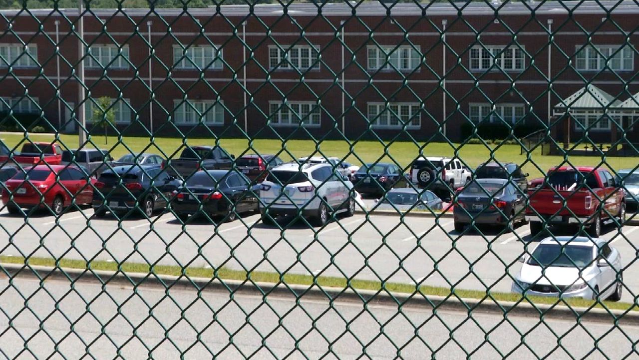 School officials say there aren’t enough parking spaces for students at Lake Minneola High, forcing some students to park in nearby subdivisions. (Sarah Panko, staff)