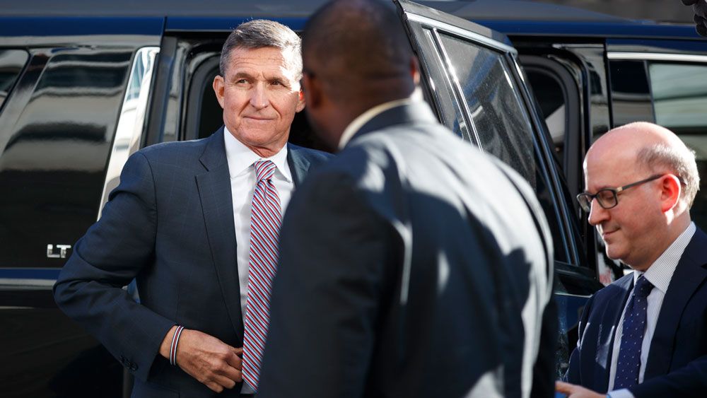 FILE - President Donald Trump's former National Security Advisor Michael Flynn arrives at federal court in Washington, Tuesday, Dec. 18, 2018. (AP Photo/Carolyn Kaster)