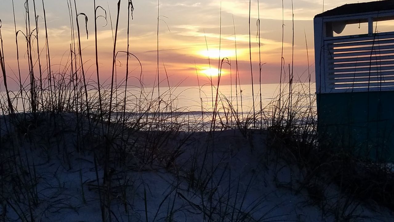 Recent sunrise from Carolina Beach.  Photo by Heidi Higgins-Sermabekian.
