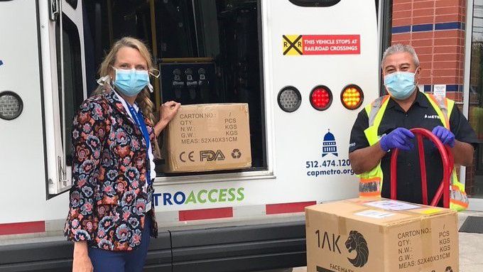 Photo of CapMetro employees unloading boxes of masks (photo credit: Capital Metro)