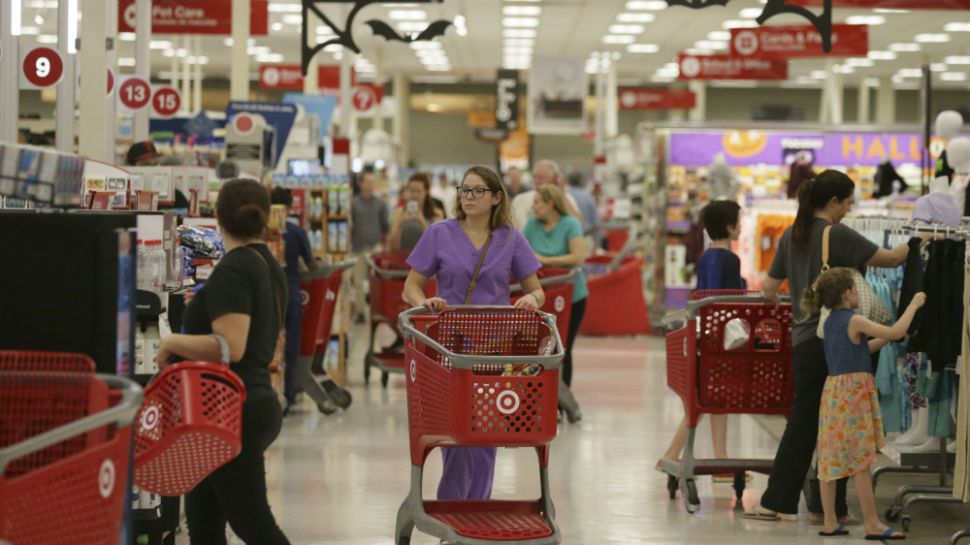 Shoppers make their way through a Target store in Dallas, Friday, Oct. 13, 2017. (AP Photo/LM Otero)