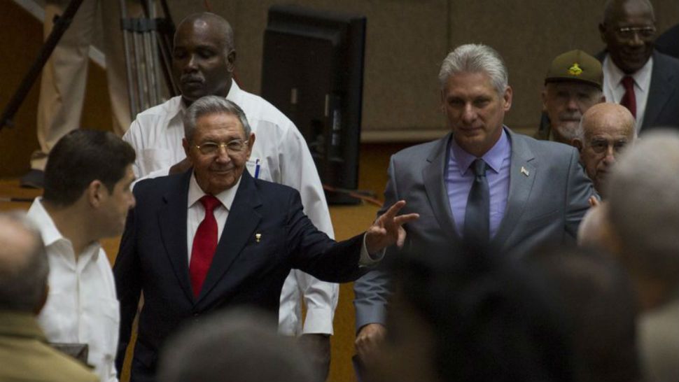 In this photo released by Cuba's state-run media Cubadebate, Cuba's President Raul Castro, center left, enters the National Assembly followed by his successor Miguel Diaz-Canel, center right, for the star of two-day legislative session in Havana, Cuba, Wednesday, April 18, 2018. The Cuban assembly selected the 57-year-old First Vice President as the sole candidate to succeed Castro on Wednesday, in a transition aimed at ensuring that the country's single-party system outlasts the aging revolutionaries who created it. (Irene Perez/Cubadebate via AP)
