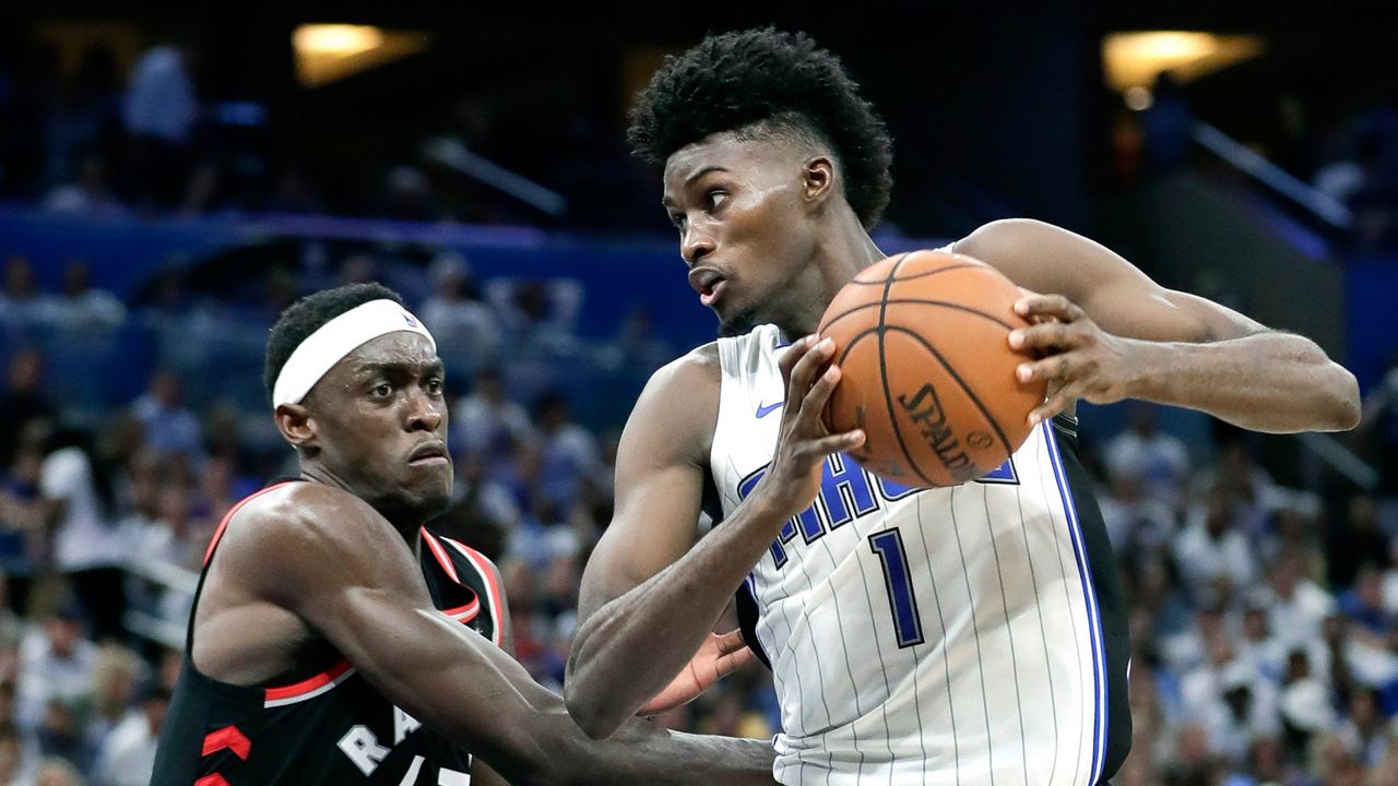 Orlando Magic's Jonathan Isaac (1) heads to the basket against Toronto Raptors' Pascal Siakam (43) during the second half in Game 3 of a first-round NBA basketball playoff series, Friday, April 19, 2019, in Orlando, Fla. (AP Photo/John Raoux)