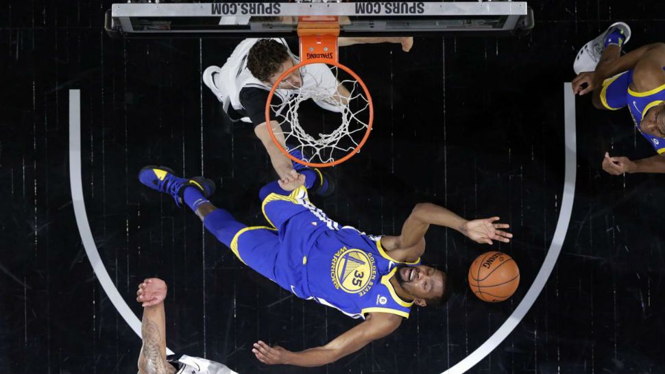 Golden State Warriors' Kevin Durant (35) is thrown back attempting to score against San Antonio Spurs' Pau Gasol, top, and forward LaMarcus Aldridge, bottom, during the second half of Game 3 of a first-round NBA basketball playoff series in San Antonio, Thursday, April 19, 2018. (AP Photo/Eric Gay)