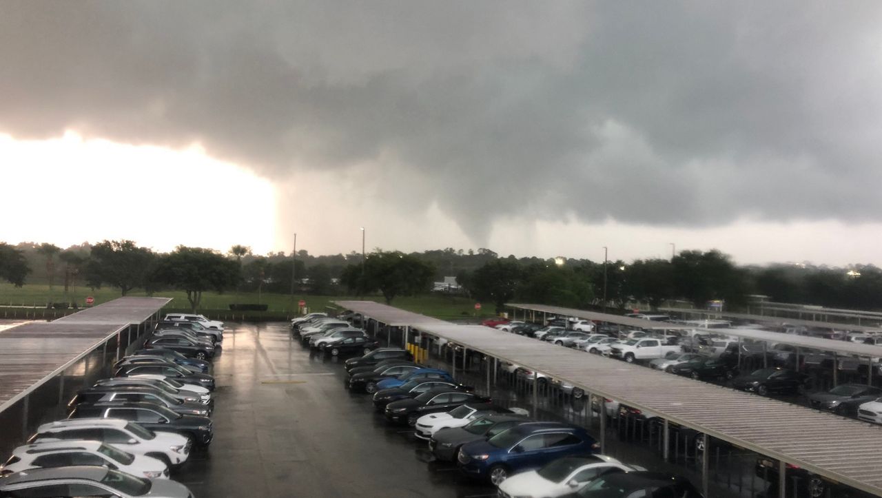 Sent via Spectrum News 13: The storm, and what appears to be a funnel cloud, near Orlando-Sanford International Airport Monday. (Elizabeth Mae Brown, Viewer)