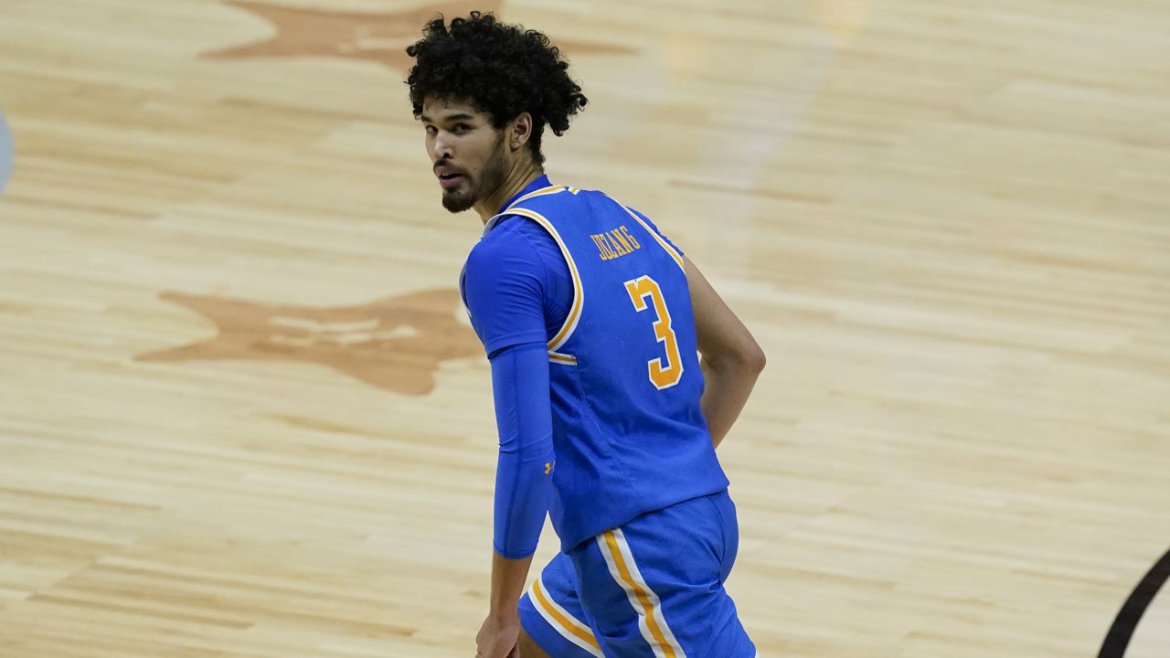UCLA guard Johnny Juzang reacts after making a 3-point basket during the second half of a men's Final Four NCAA college basketball tournament semifinal game against Gonzaga, Saturday, April 3, 2021, at Lucas Oil Stadium in Indianapolis. (AP Photo/Darron Cummings)
