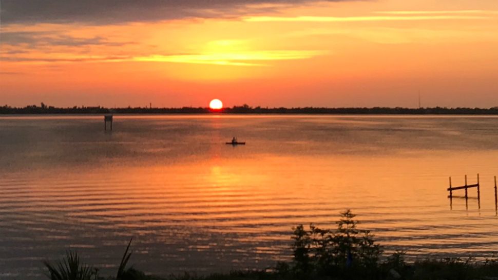 Sent to us via the Spectrum News 13 app: A kayaker navigates the Indian River in Melbourne as the sun rises in this picture taken Friday. (Kathy Ellis, viewer)