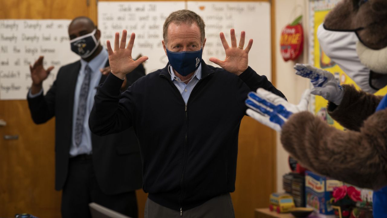 Los Angeles Unified School District Superintendent Austin Beutner participates in a classroom activity on the first day of in-person learning at Heliotrope Avenue Elementary School in Maywood, Calif., Tuesday, April 13, 2021. (AP Photo/Jae C. Hong)