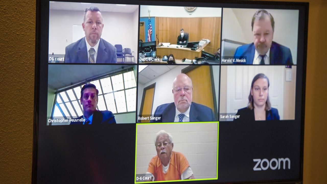 Defendants Paul Flores, top left, and his father Ruben Flores, bottom center, appear via video conference during their arraignment, Thursday, April 15, 2021, in San Luis Obispo Superior Court in San Luis Obispo, Calif. (AP Photo/Nic Coury)