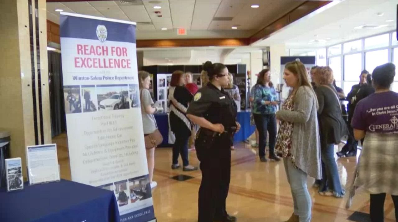 Officer talks with attendee 