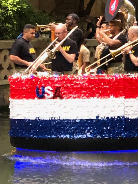 Military Fiesta Ambassadors float with 'Ft. Sam's Own' band aboard.
