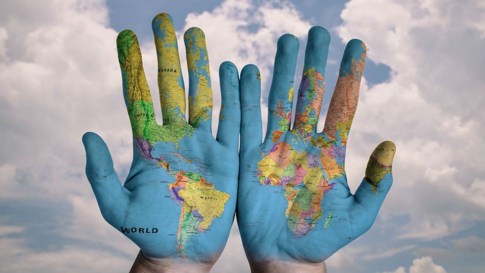 FILE photo of hands painted with a map of the Earth. There are several ways to celebrate our planet on April 22, 2019. (Pixabay)