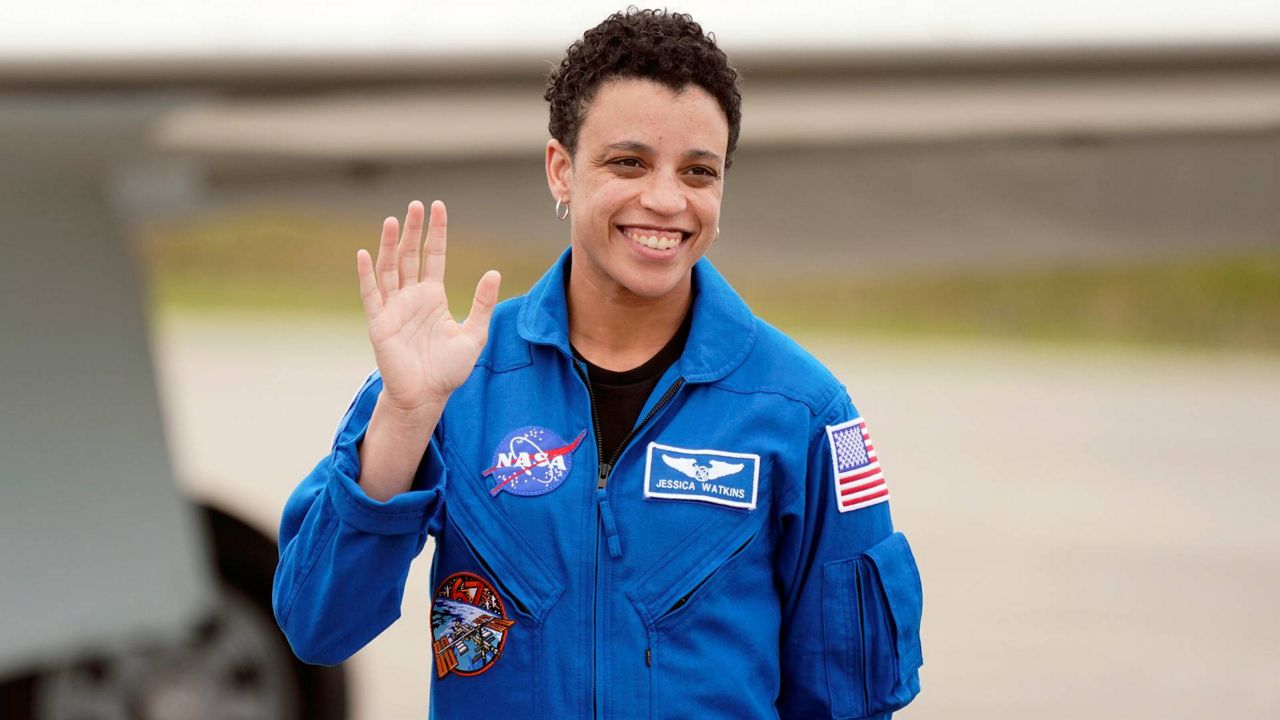 NASA astronaut, mission specialist, Jessica Watkins waves as she arrives with "Crew4" astronauts at the Kennedy Space Center in Cape Canaveral, Fla., April 18, 2022. (AP Photo/John Raoux)