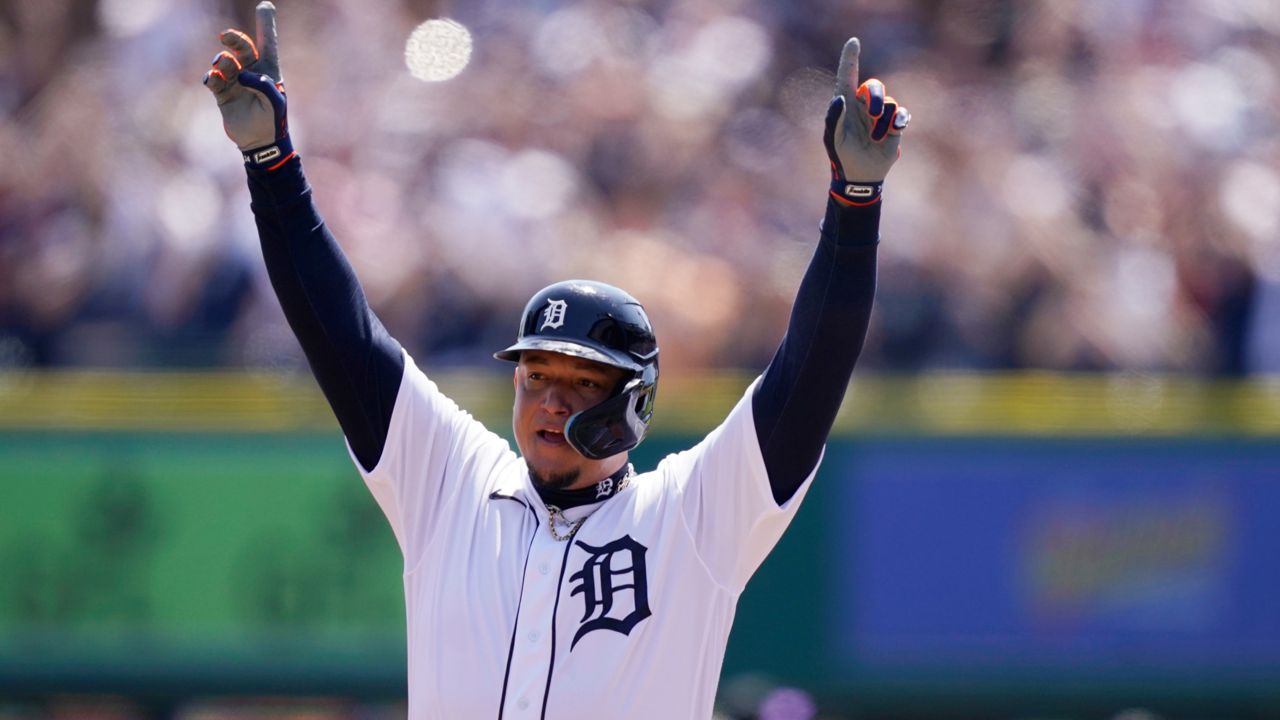 Detroit Tigers designated hitter Miguel Cabrera reacts on first base after his 3,000th career hit during the first inning of the first baseball game of a doubleheader against the Colorado Rockies, Saturday, April 23, 2022, in Detroit. (AP Photo/Carlos Osorio)