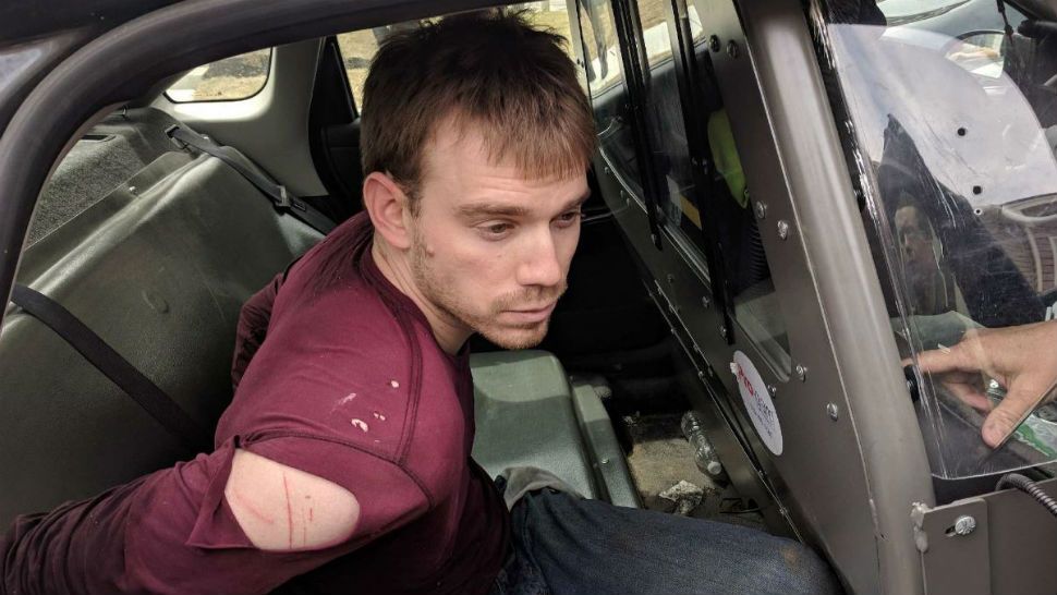 Suspect Travis Reinking in the patrol car on Monday, April 23. (Courtesy/Nashville PD)