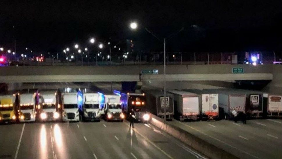 Image shared by Michigan State Metro Detroit Police of trucks lining roadway. 