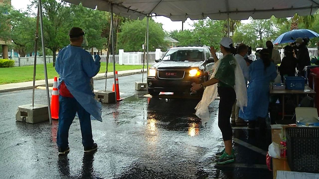 A car comes through the drive-thru testing site in Tampa Friday. (Spectrum News)