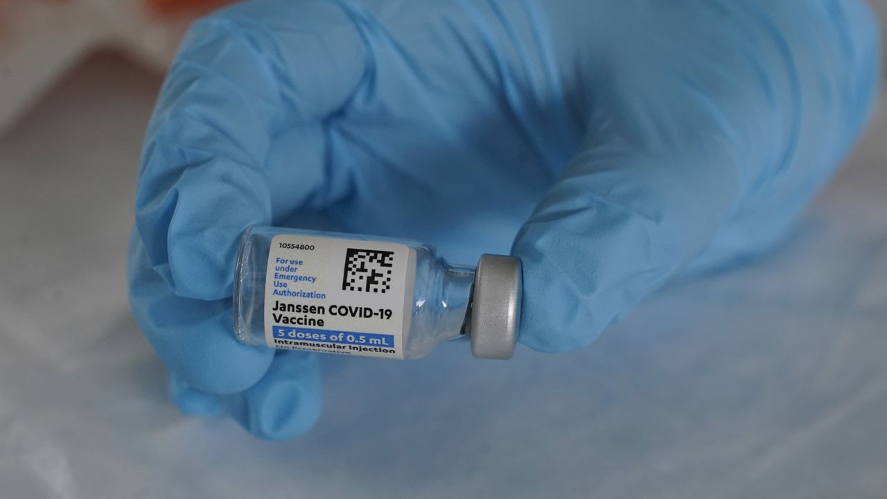 U.S. Army medic Kristen Rogers, of Waxhaw, N.C., holds a vial of the Johnson & Johnson COVID-19 vaccine in North Miami, Fla. on March 3, 2021. (AP Photo/Marta Lavandier)