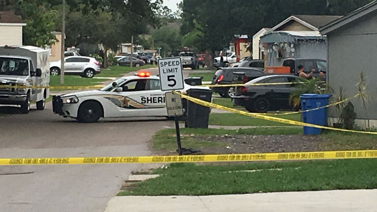 Crime scene tape cordoning off an area near Sycamore Lane and Williams Road in Tampa, Sunday, April 26, 2020. (Dave Jordan/Spectrum Bay News 9)