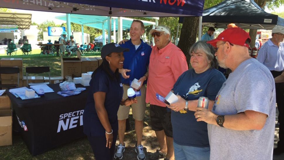 Spectrum Bay News 9 morning anchor Erica Riggins and meteorologist Brian McClure attend the Cotee River Seafest, Saturday, April 27, 2019. (Spectrum News)