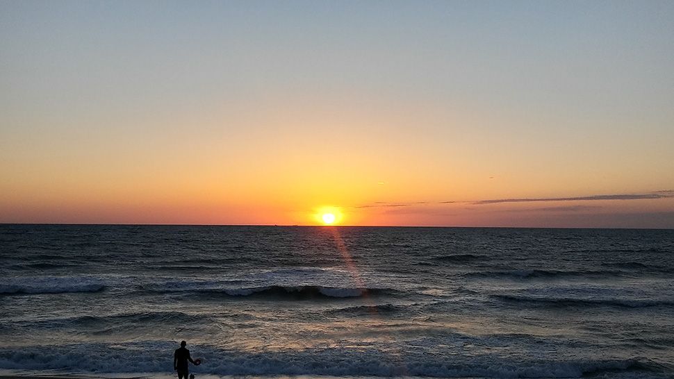 Submitted via the Spectrum News 13 app: Sunrise in Satellite Beach, Saturday, April 27, 2019. (Courtesy of viewer Mark Smith)