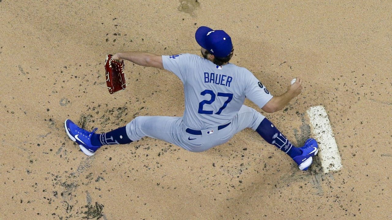 Los Angeles Dodgers starting pitcher Trevor Bauer throws during the first inning of a baseball game against the Milwaukee Brewers Thursday, April 29, 2021, in Milwaukee. (AP Photo/Morry Gash)